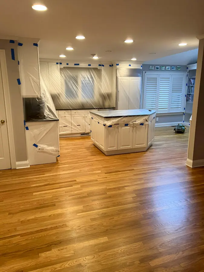 Cabinets wrapped in plastic to protect the home during work