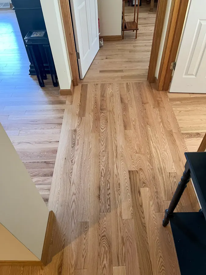 New hardwood boards woven into an existing floor